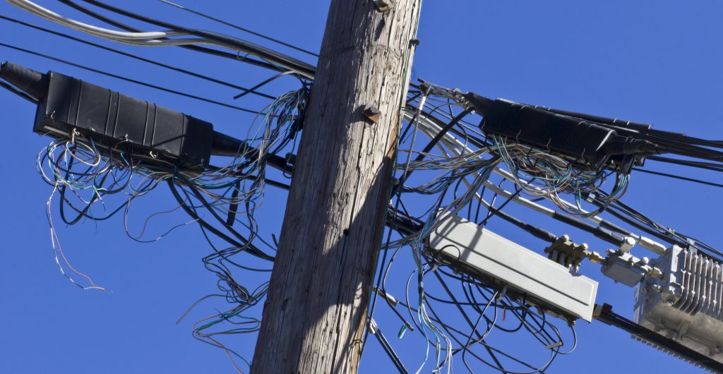 Telephone Terminals in Disarray on Phone Pole