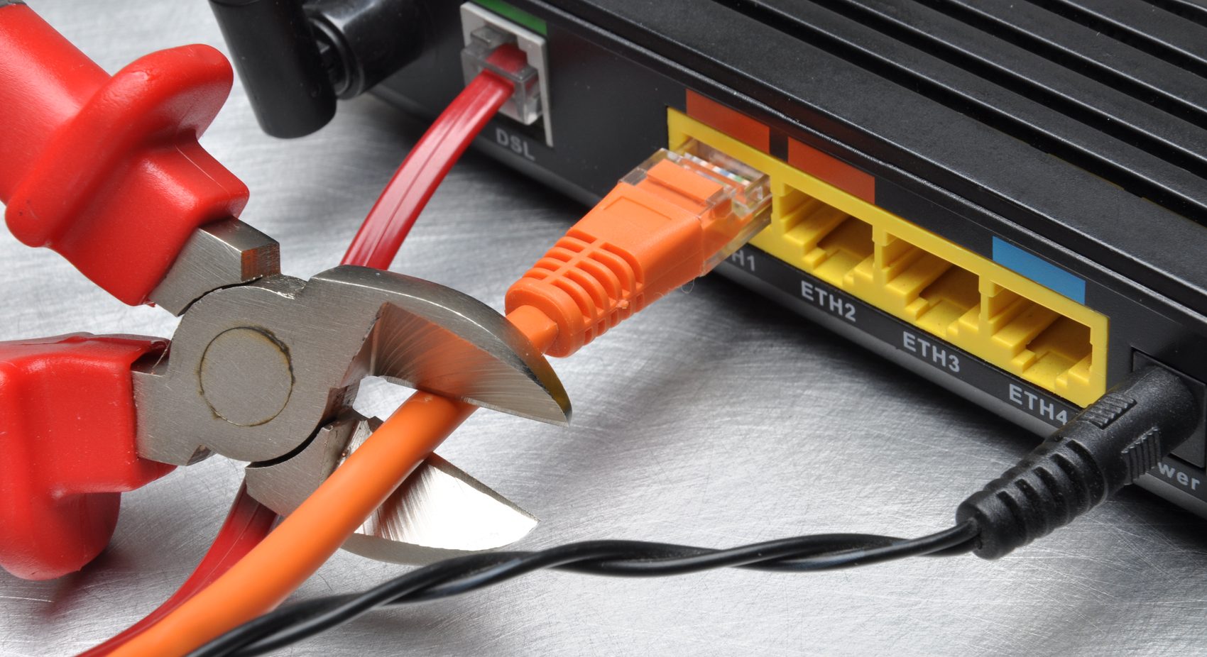 Image of a internet cable being cut.